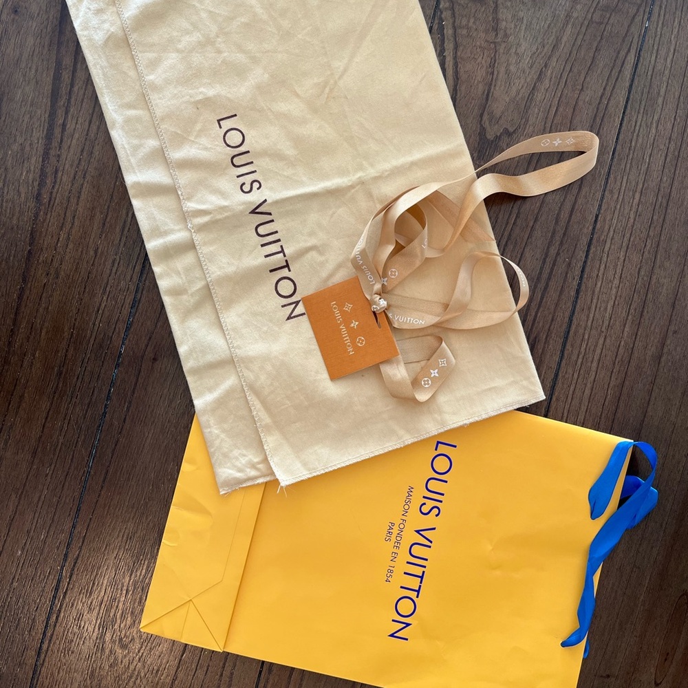 Louis Vuitton shopping bag, dust bag, ribbon and gift card.